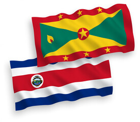 National vector fabric wave flags of Republic of Costa Rica and Grenada isolated on white background. 1 to 2 proportion.