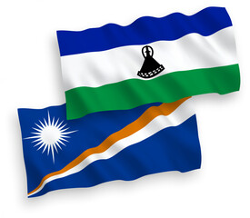 National vector fabric wave flags of Republic of the Marshall Islands and Lesotho isolated on white background. 1 to 2 proportion.