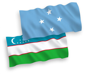 National vector fabric wave flags of Federated States of Micronesia and Uzbekistan isolated on white background. 1 to 2 proportion.