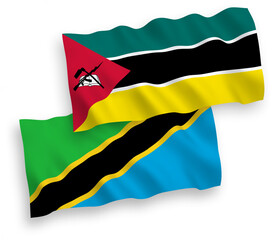 National vector fabric wave flags of Republic of Mozambique and Tanzania isolated on white background. 1 to 2 proportion.