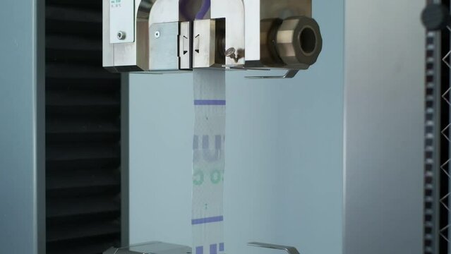Polymer thread sample tape for plastic sack bags is tested for strength in laboratory