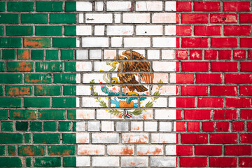National  flag of the  Mexico   on a grunge brick background.