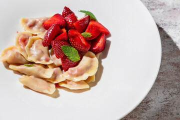 Dumplings with strawberries and mint