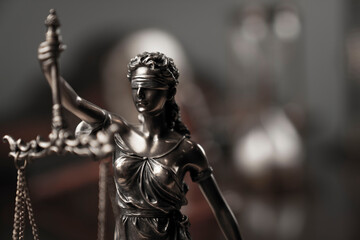 Law and justice concept. Justice symbol - Themis sculpture on gray background.