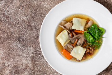 Mushroom soup with rabbit ravioli