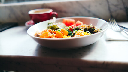 Healthy food plate on table with coffee cup