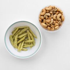 Healthy Snack of Green Pea Crisps and Salt and Pepper Cashews