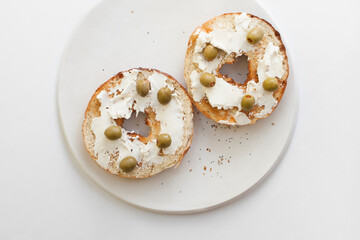 Green Olives and Cream Cheese on an Everything Bagel