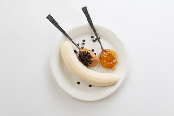 Loaded Banana Sundae Topped  with Peanut Butter, Orange Marmalade and Miniature Chocolate Chips