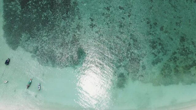 An aerial top view of blue ocean, tropical coastal waters for nature texture background