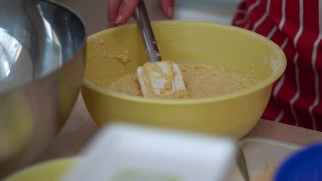 Hand Mixing Halusky In A Bowl. Bryndzove Halusky Recipe. close up