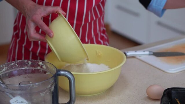 Chef Adds And Mixes Flour To Potato Dough In A Bowl. Cooking Bryndzove Halusky Dumplings, Traditional Slovakian Dish. close up