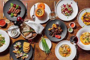Dinner of autumn season pumpkins and mushrooms