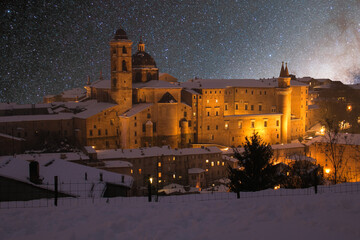 Beautiful starry sky over Urbino old city in the marche region with snow - 519740698
