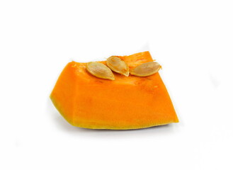 Piece of pumpkin isolated on white background. Pumpkin seed. Pumpkin pieces cut in a cube slice isolated on white background. 