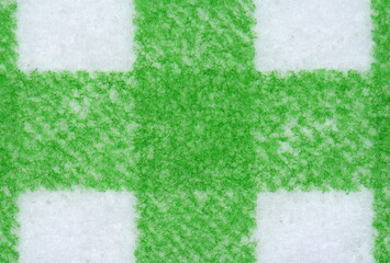 Macro shut of Clean sponge cloths with a checkered pattern texture background. Household cleaning...