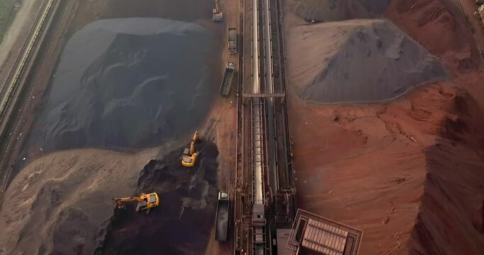 Flying Over Stockpiles Of Raw Materials, Trucks, And Equipment At The Coal Handling Station Of Paradip Port In Odisha, India. aerial
