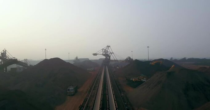 Flying Between The Stockpile Of Coal To Stacker Reclaimer Machinery At Paradip Port In India. - aerial forward