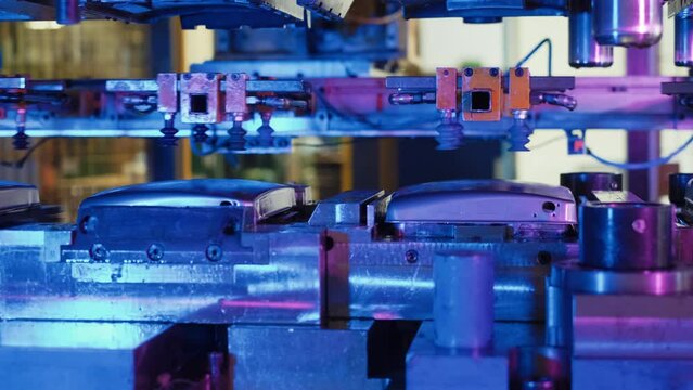 Automatic hydraulic press stamping machine and press mold bowl metal in manufacturing process. slow motion, close up.4K. 2