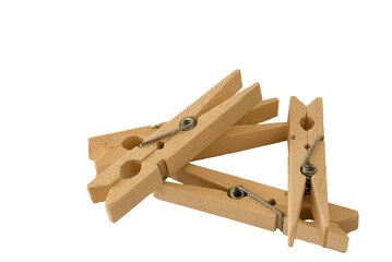 Den Helder, Netherlands. July 2022. Isolated wooden clothes pegs on white background.