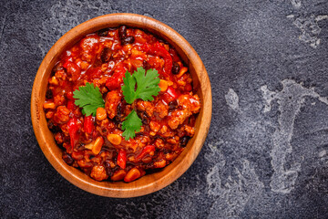 Chili Con Carne in bowl on dark background.