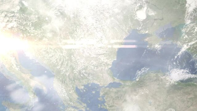 Earth zoom in from outer space to city. Zooming on Giurgiu, Romania. The animation continues by zoom out through clouds and atmosphere into space. Images from NASA