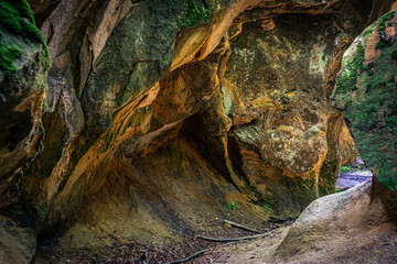 The multicolored rock formation of the Witches' Ravine located on the northern slopes of Skała Hill in Ciężkowice, Poland. An excellent tourist attraction.