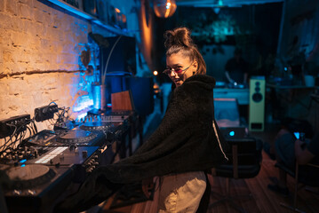 Beautiful female dancing in a small club