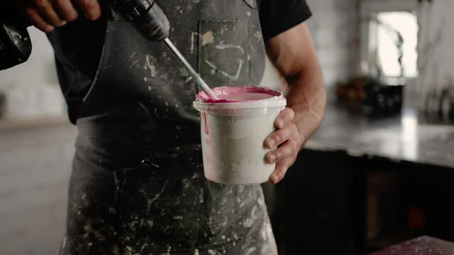 Close-up: paint is depicted with a solvent in the workshop of an artist - sculptor