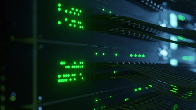 Close-up view of modern internet network switch with plugged ethernet cables. Blinking lights on internet server. Concept of big data center mining. Cloud computing and telecommunications