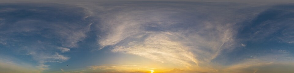 Golden glowing sunset sky panorama with Cirrus clouds. Hdr seamless spherical equirectangular 360...
