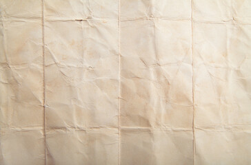 Pale old yellow paper background texture. Rough light brown kraft paper with pulp texture for background. High resolution texture backdrop. Crumpled paper.