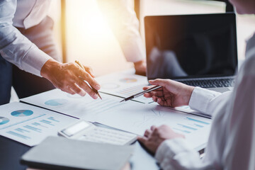 Young colleagues having great business conversations in a modern coworking office. Teamwork concept. Horizontal blurry background. Fireworks.
