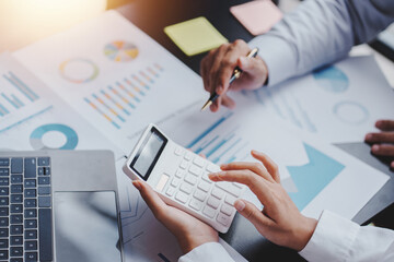 The financiers are calculating personal taxes for their customers.