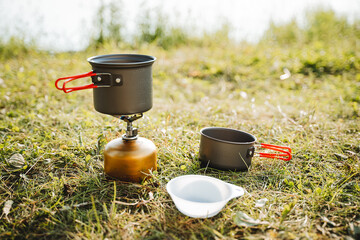 A set of dishes for a tourist on a hike, compact equipment, a small volume of a cup, a tourist...
