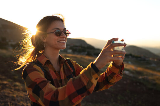 girl taking pictures on the phone