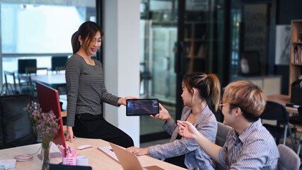 Software engineers, software developers team working on project and collaborating in friendly atmosphere