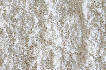 Fluffy carpet beige backdrop, textile background