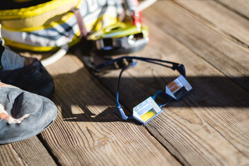 Climbing equipment on wooden background