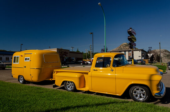 Yellow 1955 Chevrolet pickup truck and matching Boler trailer at Drumheller 08/06/2012 Canada