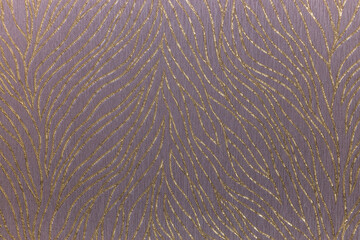 Fragment of colorful retro tapestry textile pattern with gold texture