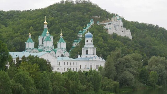 Svyatogorsk Lavra, Donetsk region, Ukraine. A beautiful old monastery is located in the valley of the Seversky Donets River on a mountain around the green foliage of trees