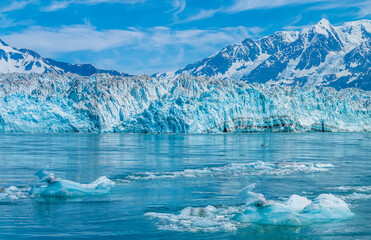 A view of icebergs in front of the snout of the Hubbard Glacier in Alaska in summertime
