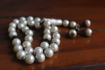 a pearl prayer beads on the table