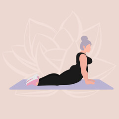 Body positive woman doing yoga cobra pose