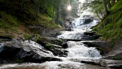 Beautiful waterfall in forest. Waterfall Kozice near Fojnica, Bosnia and Herzegovina. River cascade. Water flows over the rocks in the mountain. - Powered by Adobe