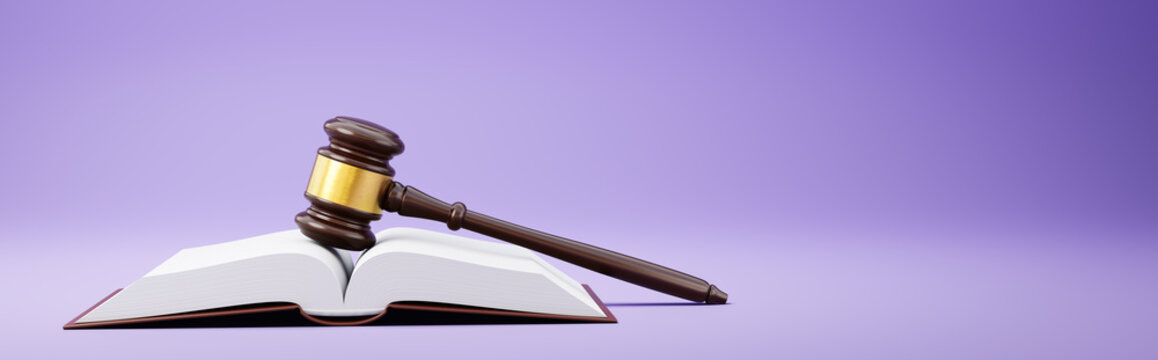 Judge's Gavel and an Open Book on Purple Background
