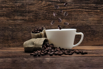 coffee beans roasted dark. coffee beans and coffee white cup