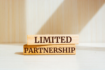 Wooden blocks with words 'Limited partnership'. Business concept