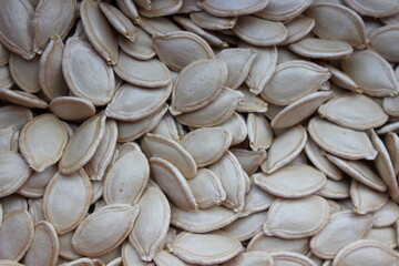 Background of large beautiful edible pumpkin seeds.